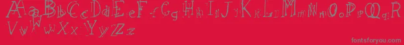 フォントLeapingTypewriter – 赤い背景に灰色の文字