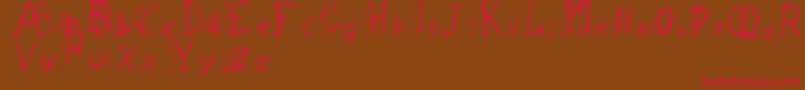 LeapingTypewriter Font – Red Fonts on Brown Background