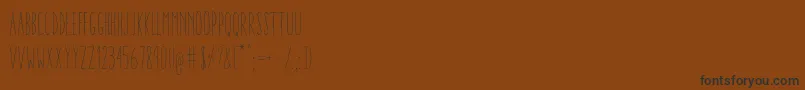 AracneUltraCondensedLight-Schriftart – Schwarze Schriften auf braunem Hintergrund
