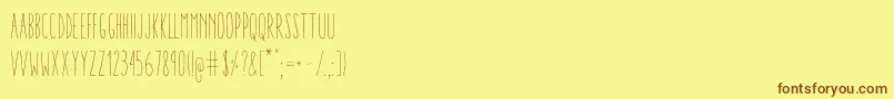 Fonte AracneUltraCondensedLight – fontes marrons em um fundo amarelo