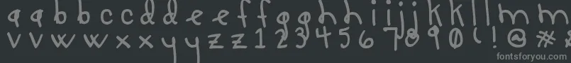 フォントLucyLuToo – 黒い背景に灰色の文字