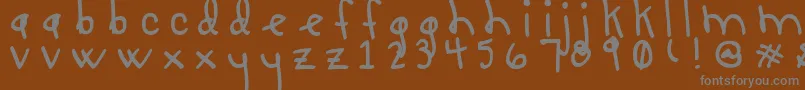 フォントLucyLuToo – 茶色の背景に灰色の文字