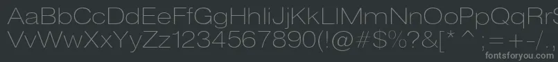 Heliosextthinc-fontti – harmaat kirjasimet mustalla taustalla