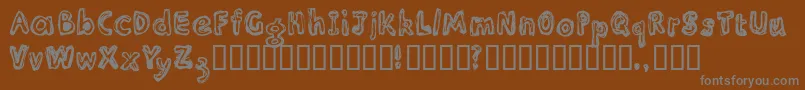 フォントInlir – 茶色の背景に灰色の文字