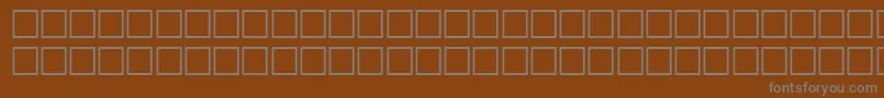 Fonte TileRegular – fontes cinzas em um fundo marrom