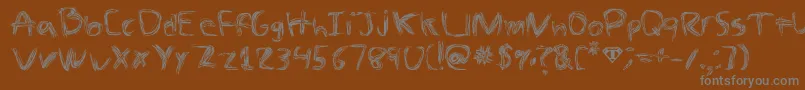 フォントTheSpaz – 茶色の背景に灰色の文字
