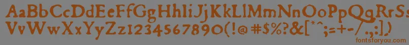 フォントDubellay – 茶色の文字が灰色の背景にあります。