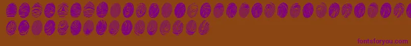 Czcionka Powdrfp – fioletowe czcionki na brązowym tle