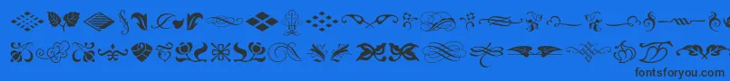 Czcionka Typeembellishmentsone – czarne czcionki na niebieskim tle