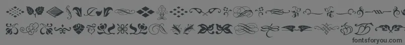 Fonte Typeembellishmentsone – fontes pretas em um fundo cinza