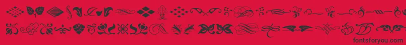 フォントTypeembellishmentsone – 赤い背景に黒い文字