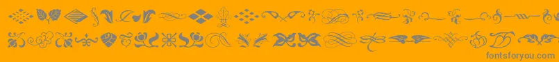 Typeembellishmentsone-Schriftart – Graue Schriften auf orangefarbenem Hintergrund