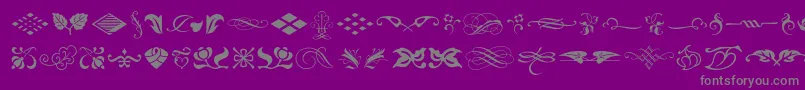 Typeembellishmentsone-Schriftart – Graue Schriften auf violettem Hintergrund