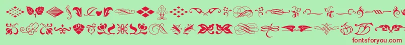 Typeembellishmentsone-Schriftart – Rote Schriften auf grünem Hintergrund