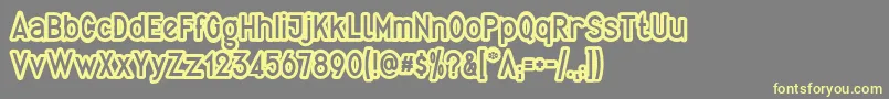 QuirkusOut-Schriftart – Gelbe Schriften auf grauem Hintergrund