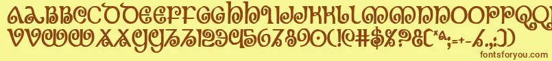 フォントTheShireBoldCondensed – 茶色の文字が黄色の背景にあります。