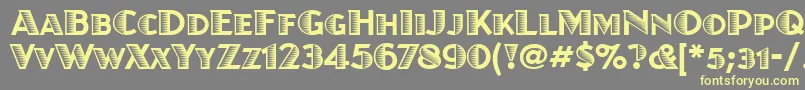 フォントJuanitaxiloitcTt – 黄色のフォント、灰色の背景