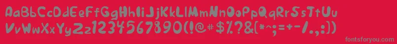 JapestylePlain-fontti – harmaat kirjasimet punaisella taustalla