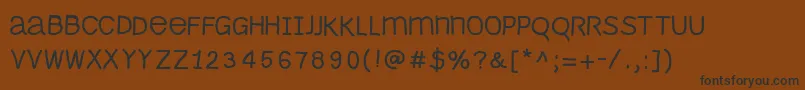 Monomouse Font – Black Fonts on Brown Background