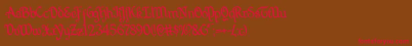 Quillswordrotate Font – Red Fonts on Brown Background