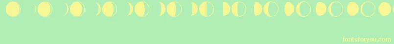フォントMoonPhases – 黄色の文字が緑の背景にあります
