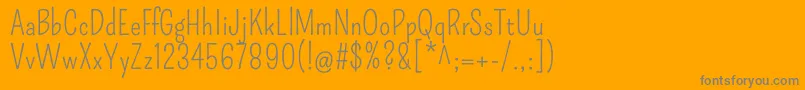 Czcionka PompiereRegular – szare czcionki na pomarańczowym tle