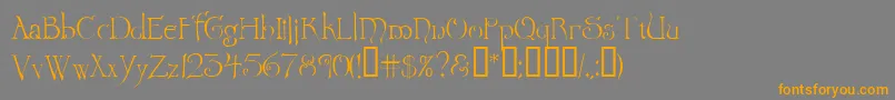 フォントWretrg – オレンジの文字は灰色の背景にあります。