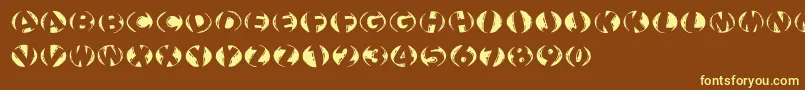 Woodcuttedcapsinversfs-fontti – keltaiset fontit ruskealla taustalla