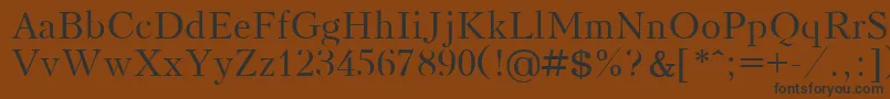 フォントKudrashovPlain.001.001 – 黒い文字が茶色の背景にあります