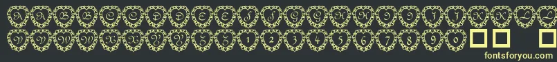 フォント101 Heart Framed – 黒い背景に黄色の文字