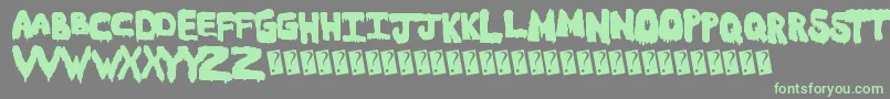 Czcionka Meltasstic – zielone czcionki na szarym tle