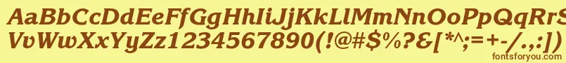 フォントKorinnablackcKursiv – 茶色の文字が黄色の背景にあります。