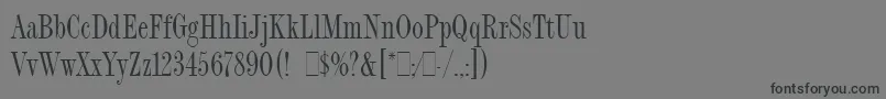 フォントFashionCompressedLetPlain.1.0 – 黒い文字の灰色の背景