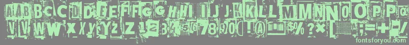 Mustasurma-Schriftart – Grüne Schriften auf grauem Hintergrund