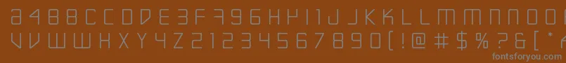 Escapeartisttitle Font – Gray Fonts on Brown Background