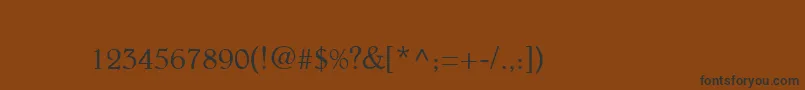 フォントBeltheder – 黒い文字が茶色の背景にあります