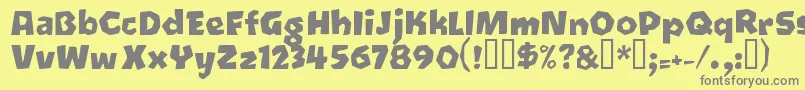 フォントOetztyp ffy – 黄色の背景に灰色の文字