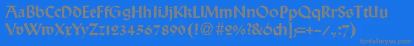 WallabyRegularDb-fontti – harmaat kirjasimet sinisellä taustalla
