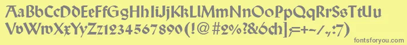 WallabyRegularDb-fontti – harmaat kirjasimet keltaisella taustalla