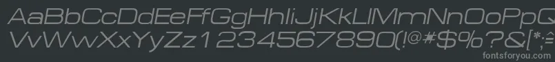 MichaeldbItalic-fontti – harmaat kirjasimet mustalla taustalla