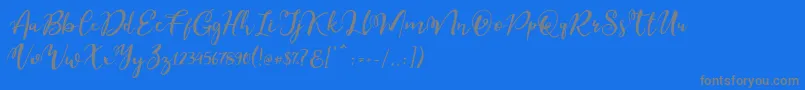 Esteh-Schriftart – Graue Schriften auf blauem Hintergrund