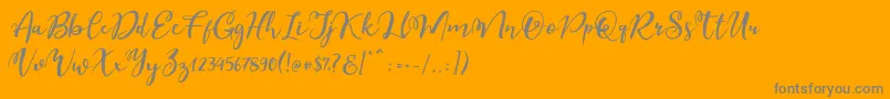 Esteh-Schriftart – Graue Schriften auf orangefarbenem Hintergrund