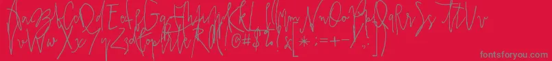 フォントPrestigescriptalt – 赤い背景に灰色の文字