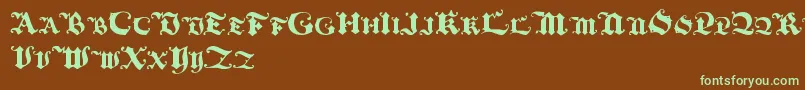 フォントBlackinitialtext – 緑色の文字が茶色の背景にあります。
