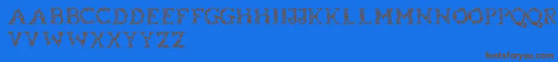 フォントTribalcase – 茶色の文字が青い背景にあります。