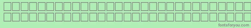 McsHor4SUBite2000-fontti – harmaat kirjasimet vihreällä taustalla