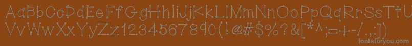 Hellodotstick-Schriftart – Graue Schriften auf braunem Hintergrund