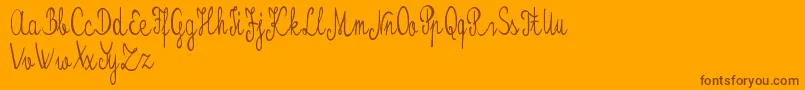 Kristalypersonaluse-Schriftart – Braune Schriften auf orangefarbenem Hintergrund