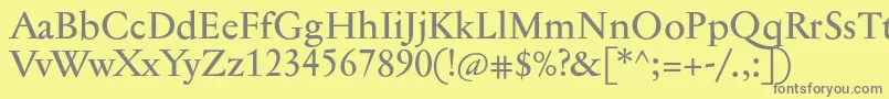 Jannontextmed-fontti – harmaat kirjasimet keltaisella taustalla