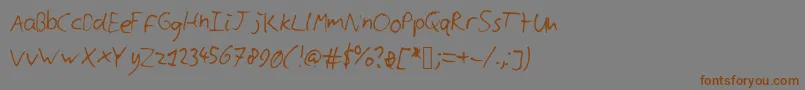 フォントCyllshandwriting – 茶色の文字が灰色の背景にあります。